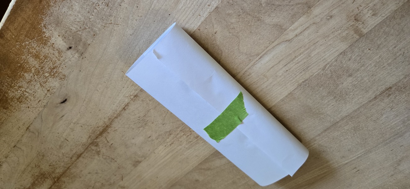 Cigars wrapped in paper ready for press